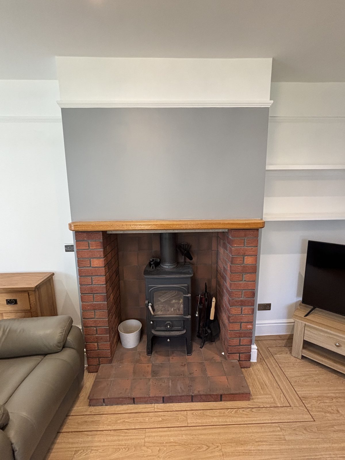Lounge after renovation with fireplace feature wall, North Devon