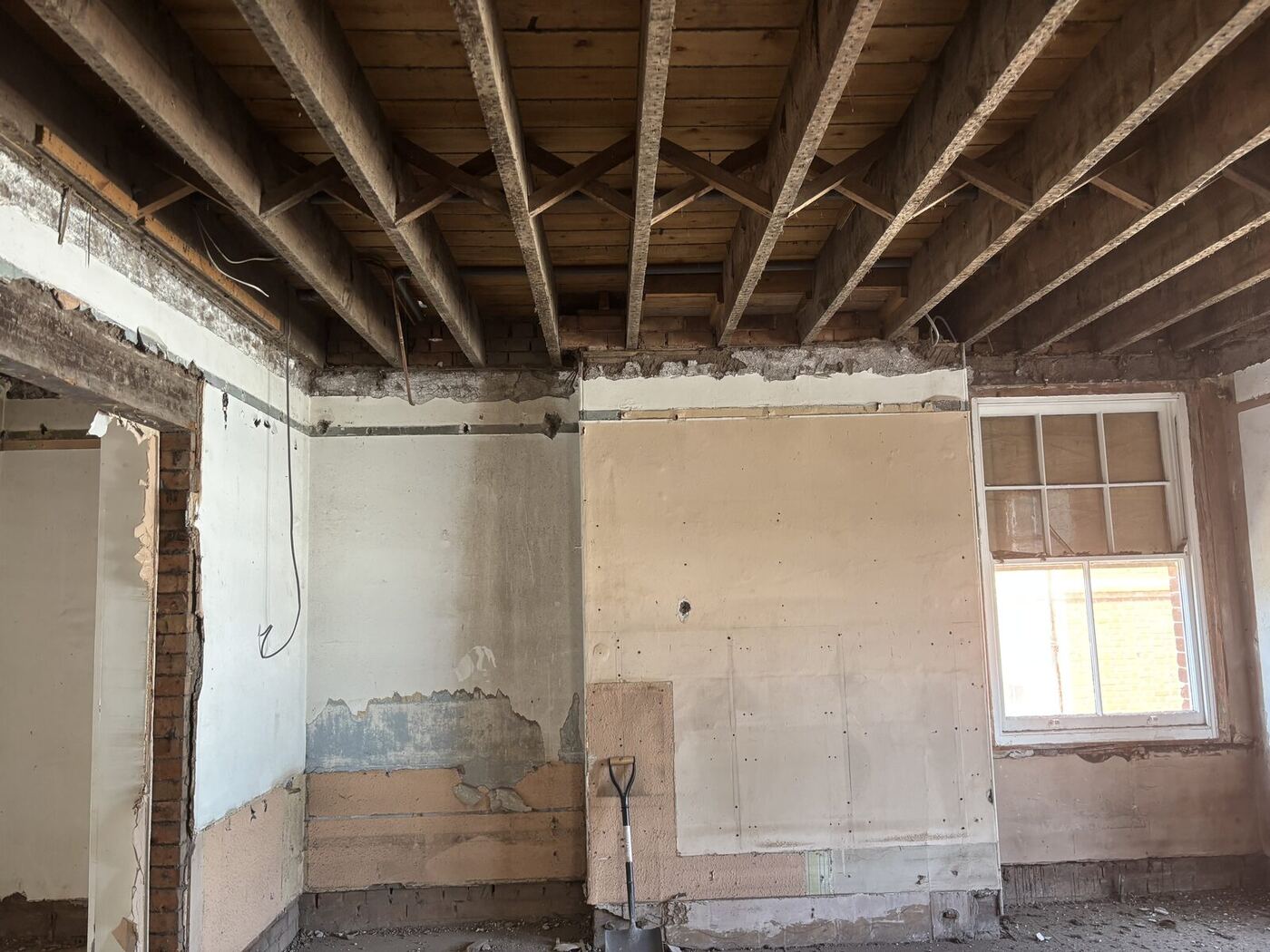 Stripped out room with exposed ceiling joists