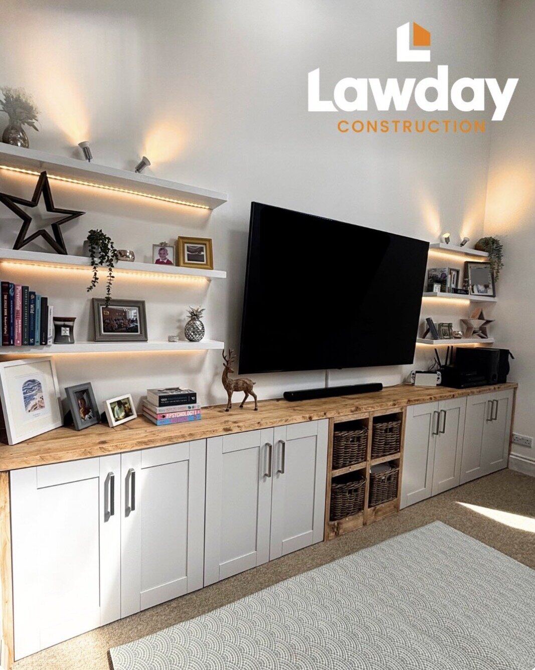 Media wall with ambient lighting and floating shelves