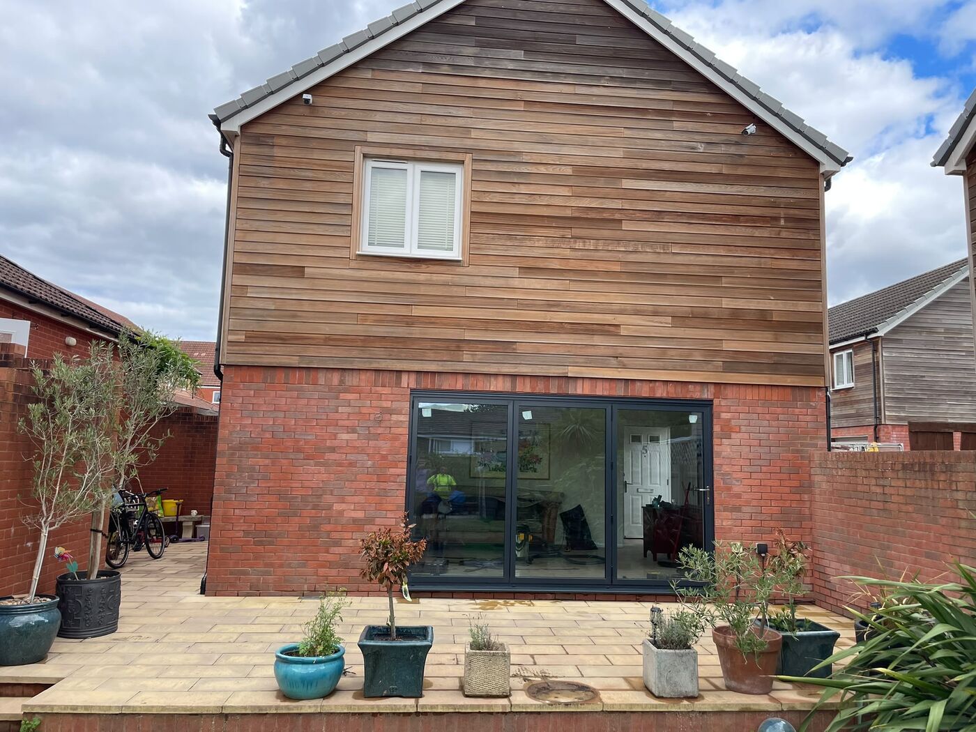 Completed rear elevation with brickwork made good and bi-fold doors in place
