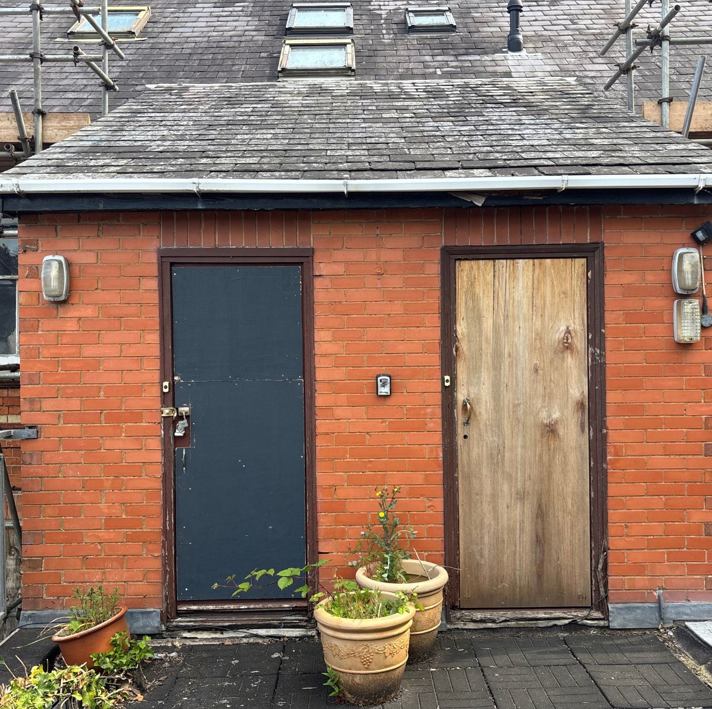 Old doorways onto the flat roof before blocking up