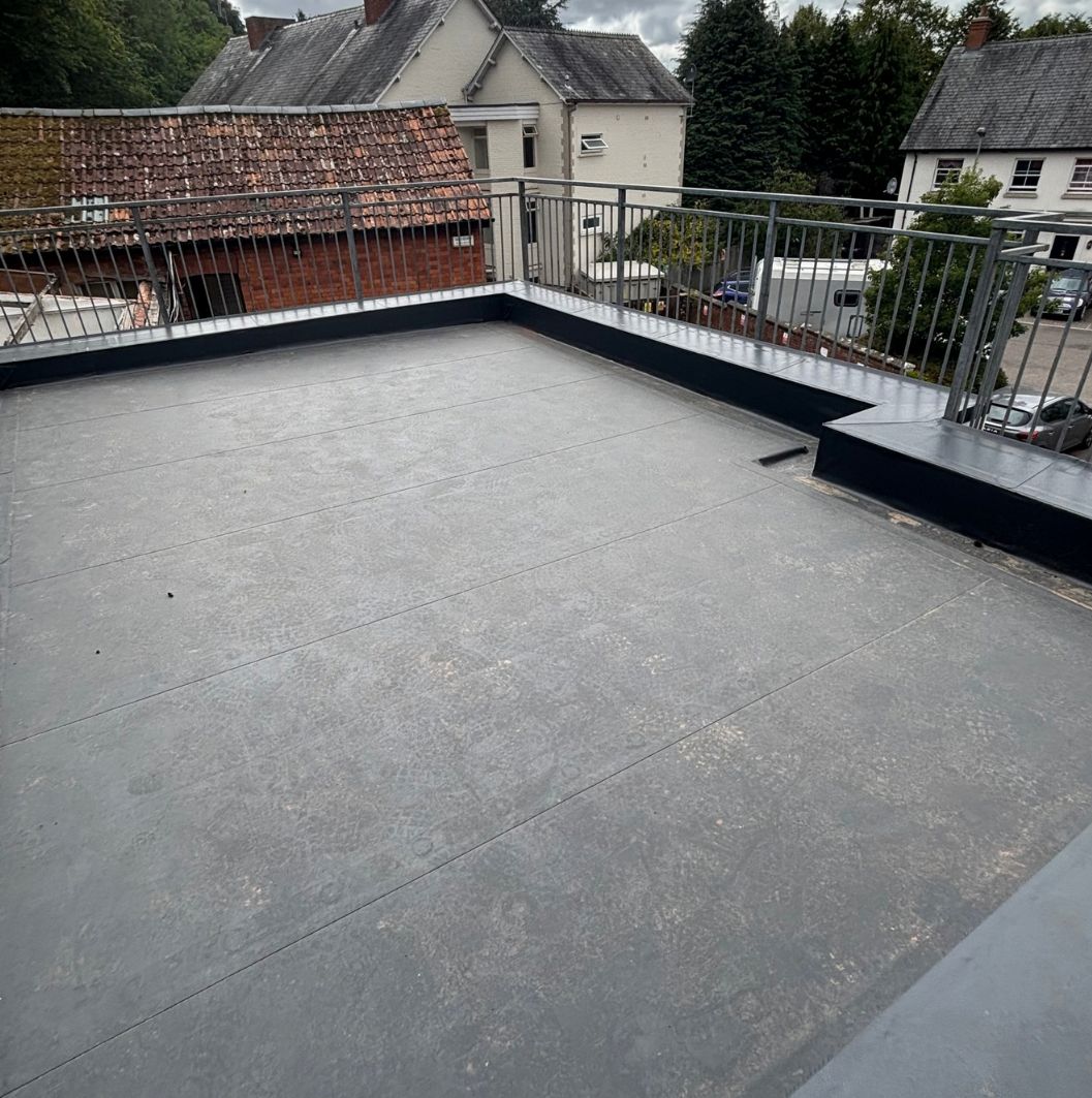Finished single ply membrane roof with parapets